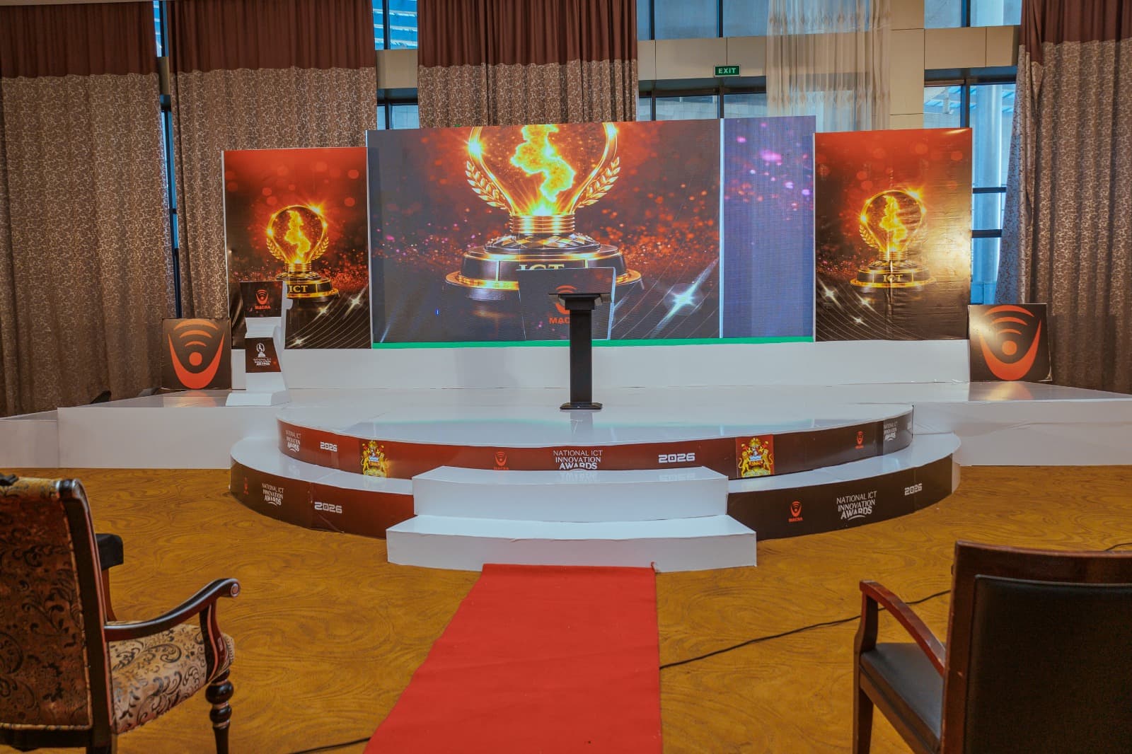 Awards stage setup with branded LED screens and podium